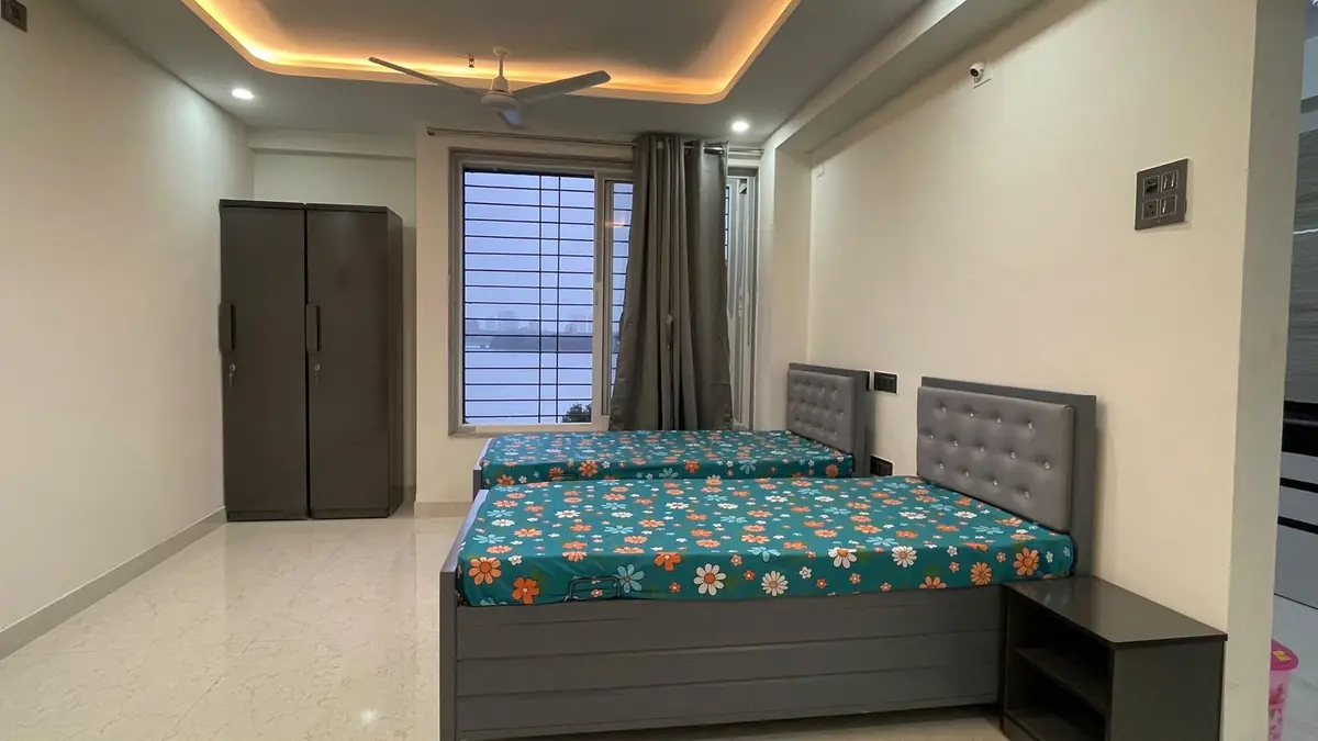 Twin sharing room with wardrobe at Prestige Stay